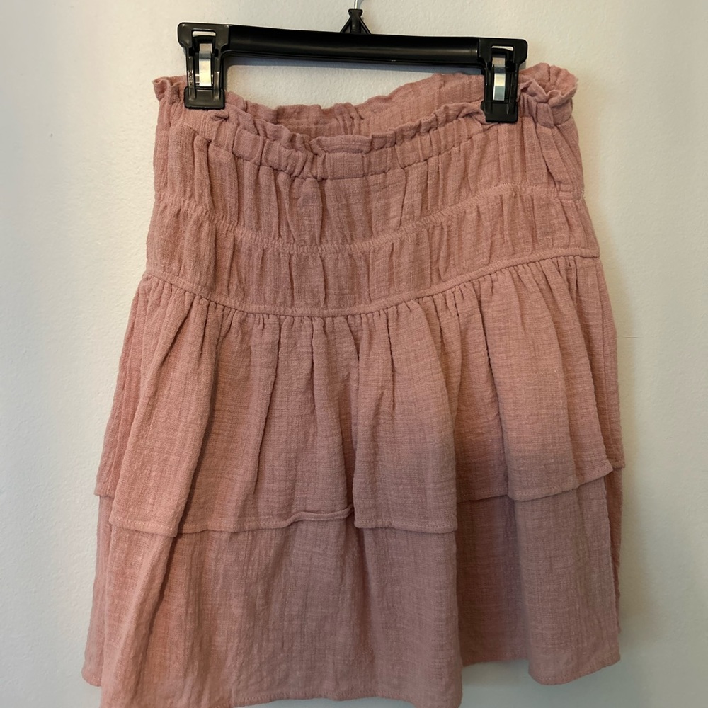 A pink skirt that is flowy and easy to move in. Size small